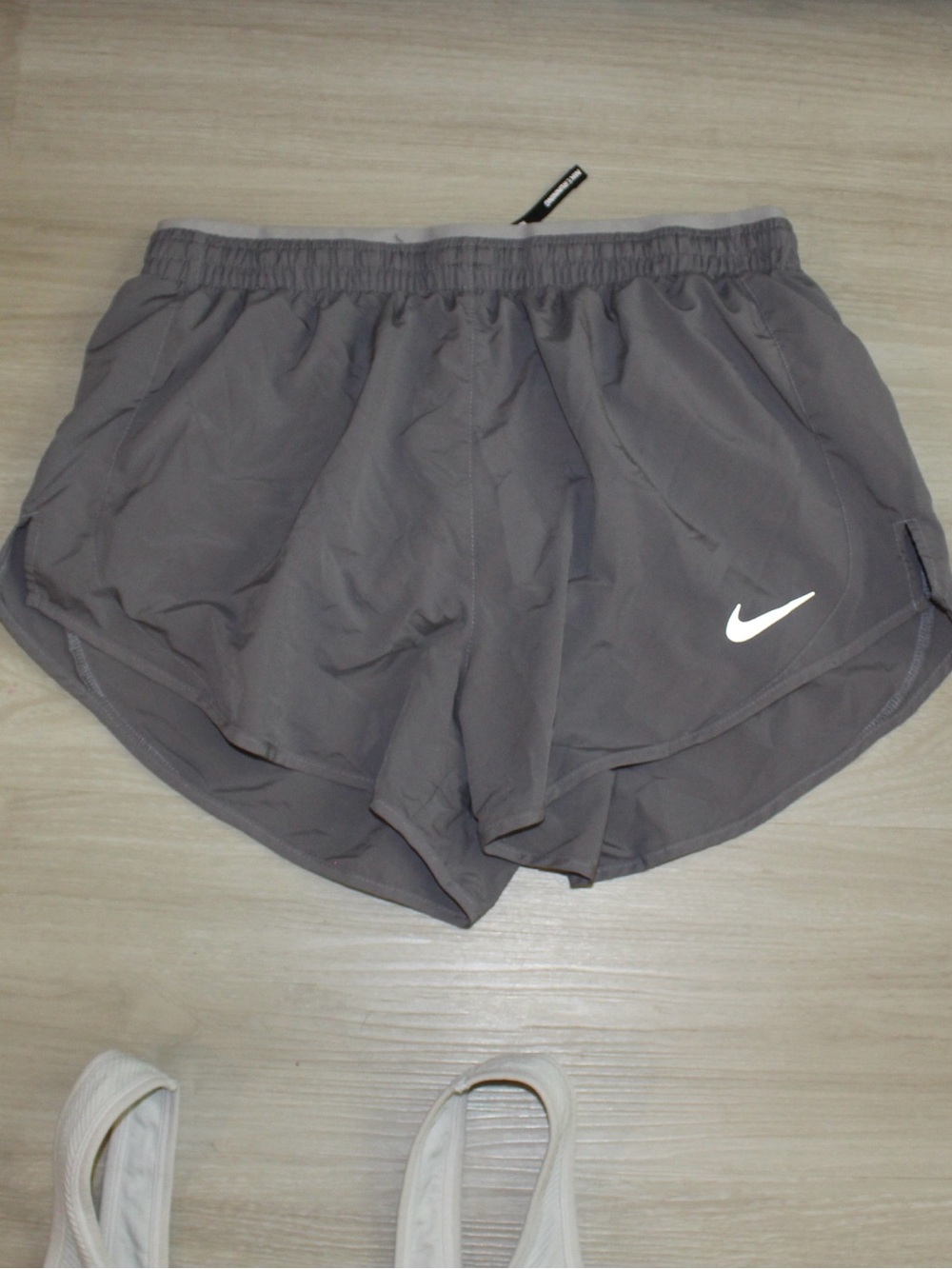 Nike Women's Gray Athletic Running Shorts with White Swoosh